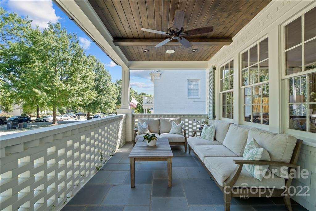 2156 Colony Road Charlotte, NC 28209 - Photo 4 of 46 a balcony with furniture and a potted plant