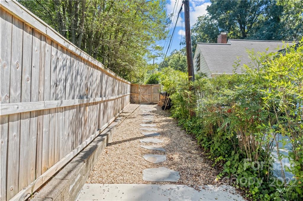 2156 Colony Road Charlotte, NC 28209 - Photo 46 of 46 a view of a pathway with a couple of flower in front of house