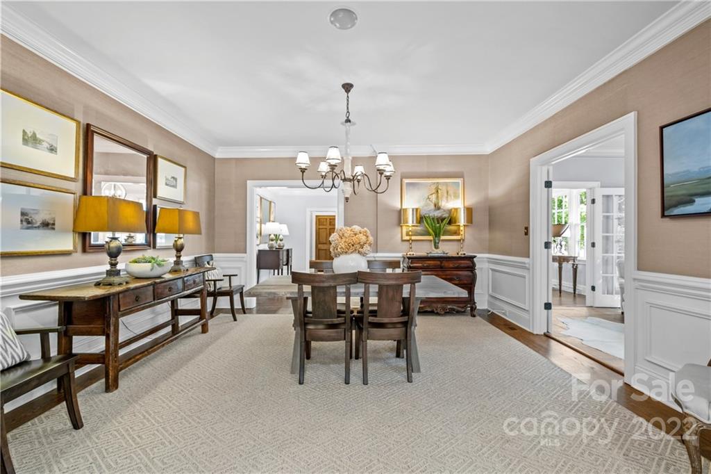 2156 Colony Road Charlotte, NC 28209 - Photo 10 of 46 a view of a dining room with furniture and a chandelier