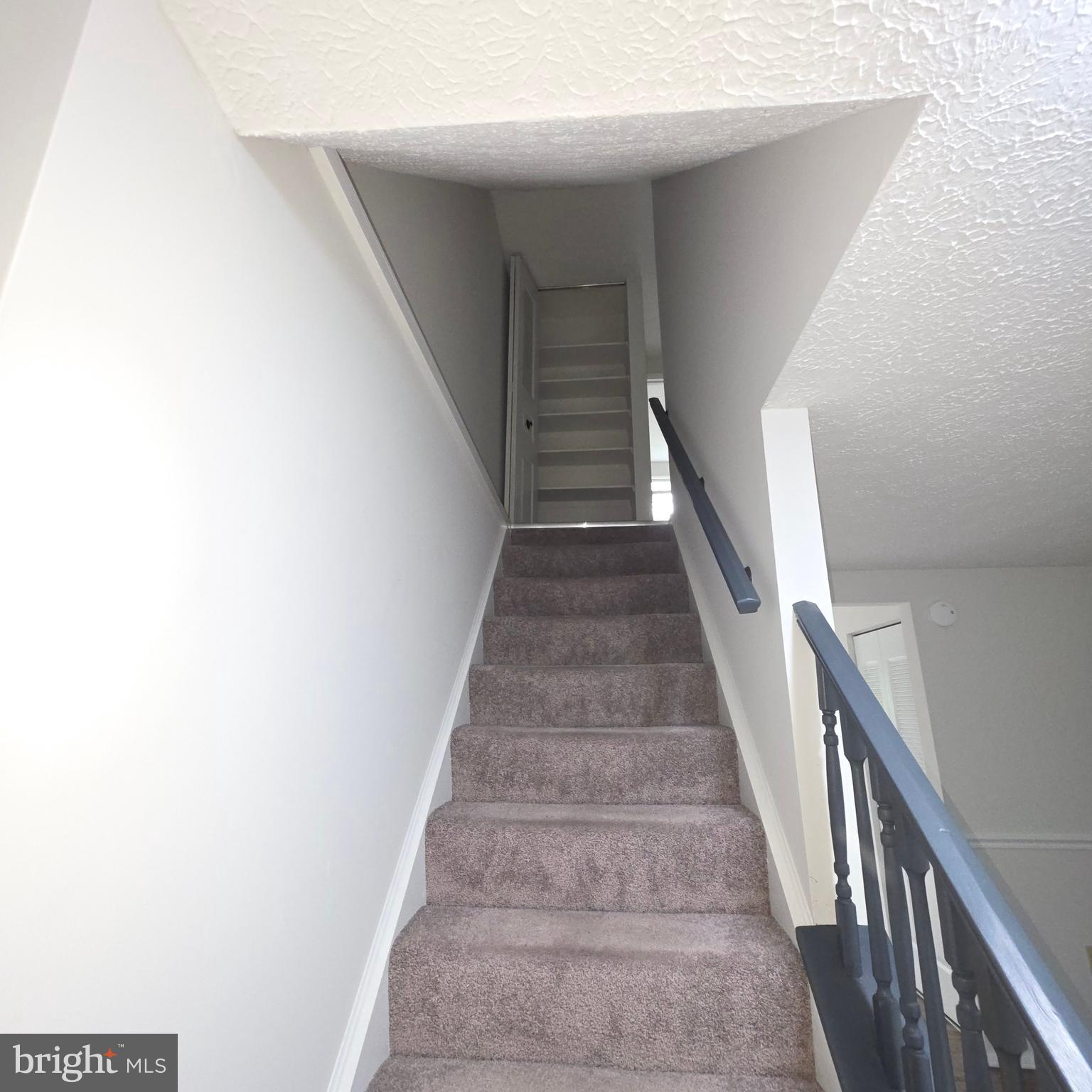 1758 Springfield Lane Frederick, MD 21702 - Photo 18 of 31 a view of staircase with white walls and white walls