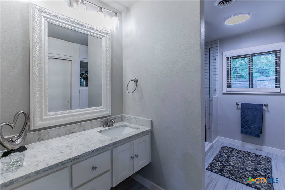 2518 Marlandwood Road Temple, TX 76502 - Photo 20 of 48 a bathroom with a sink and a mirror