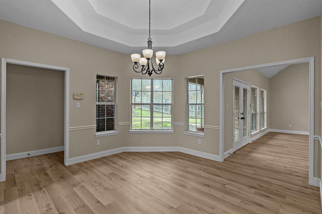 4510 Dexham Road Rowlett, TX 75088 - Photo 13 of 33 a view of livingroom with hardwood floor and window