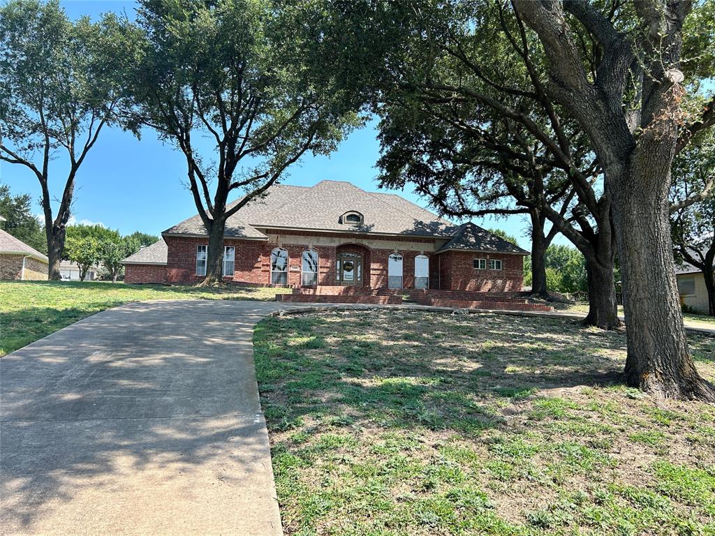4510 Dexham Road Rowlett, TX 75088 - Photo 2 of 33 a front view of a house with garden