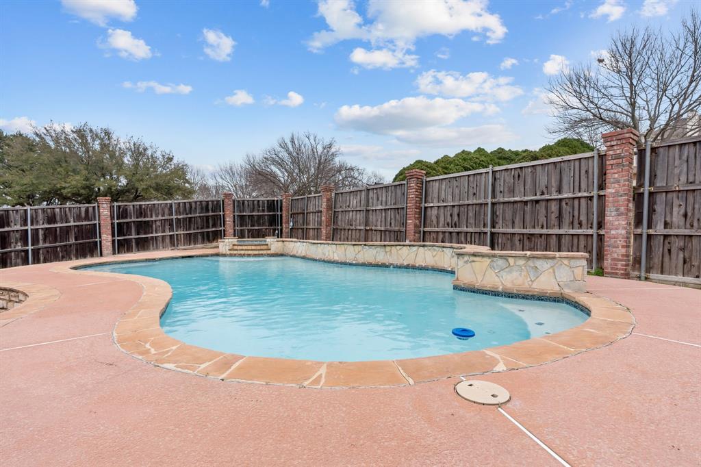 4510 Dexham Road Rowlett, TX 75088 - Photo 26 of 33 a view of a swimming pool with a yard