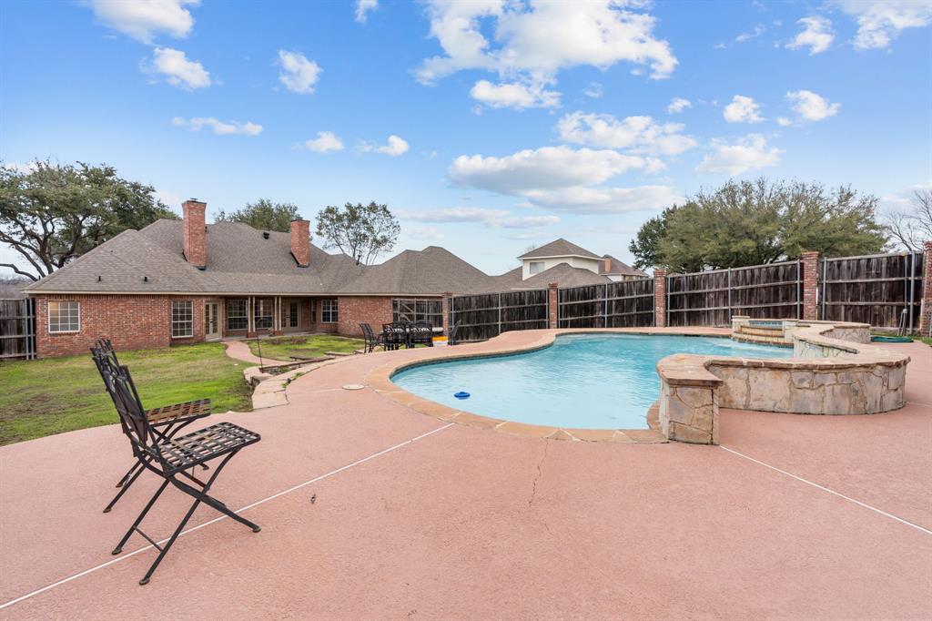 4510 Dexham Road Rowlett, TX 75088 - Photo 27 of 33 a view of a house with swimming pool and sitting area