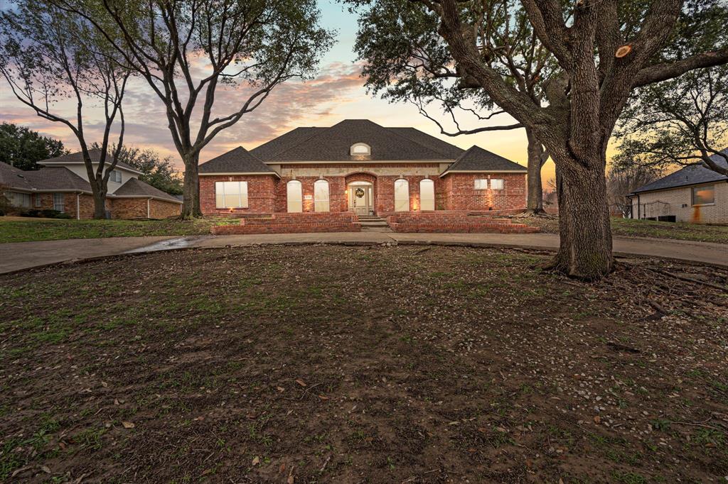 4510 Dexham Road Rowlett, TX 75088 - Photo 3 of 33 a front view of a house with a yard