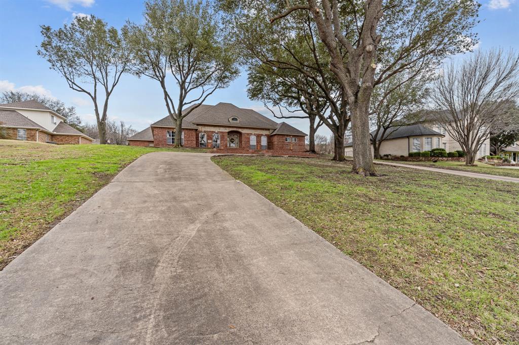 4510 Dexham Road Rowlett, TX 75088 - Photo 5 of 33 a view of a yard with a large trees