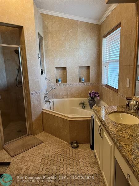 Keystone Lake Pembroke Pines, FL 33029 - Photo 19 of 23 a bathroom with a granite countertop sink and a bathtub