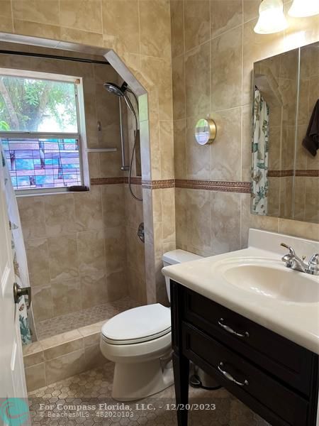 Keystone Lake Pembroke Pines, FL 33029 - Photo 21 of 23 a bathroom with a sink a toilet and shower
