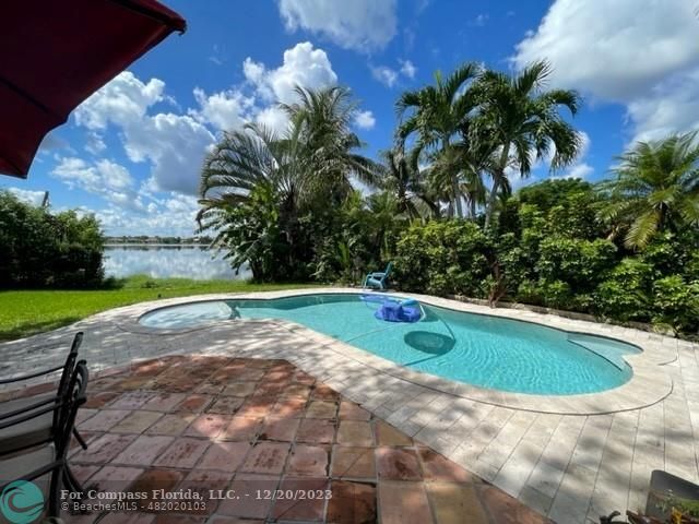 Keystone Lake Pembroke Pines, FL 33029 - Photo 5 of 23 a view of a swimming pool and a yard