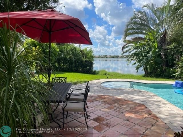 Keystone Lake Pembroke Pines, FL 33029 - Photo 7 of 23 a view of a swimming pool with a patio