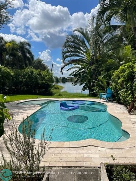 Keystone Lake Pembroke Pines, FL 33029 - Photo 8 of 23 a view of a swimming pool with a yard