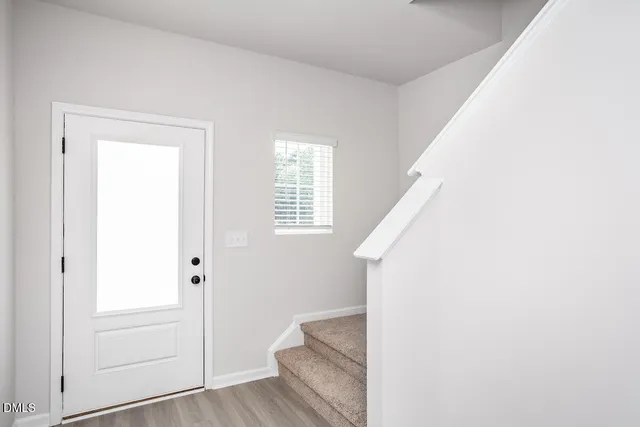 a view of entryway with wooden floor