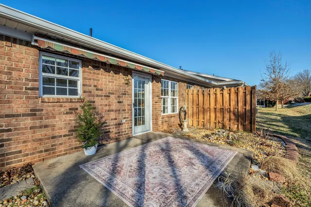 a view of backyard with a patio