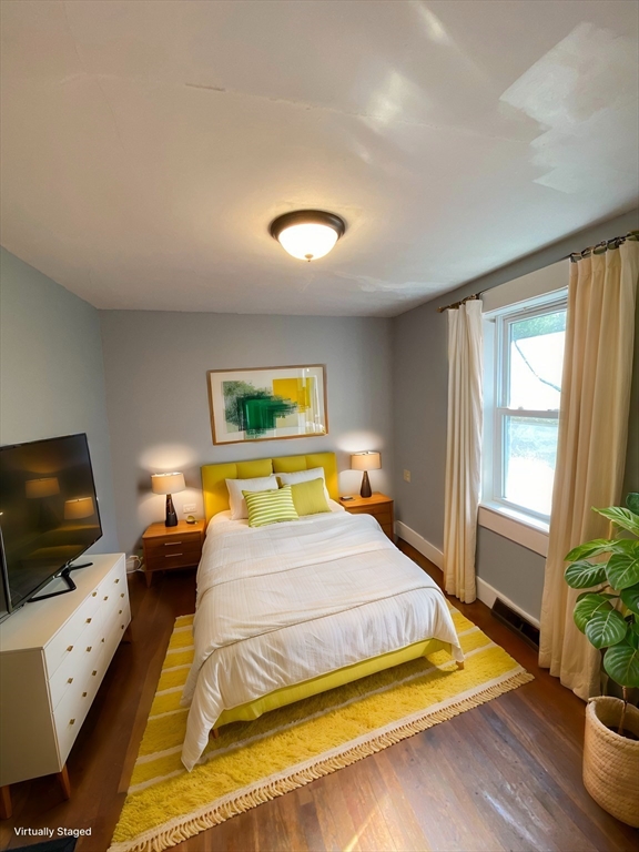 50 Volusia Road Hingham, MA 02043 - Photo 8 of 11 a bedroom with a bed and flat screen tv