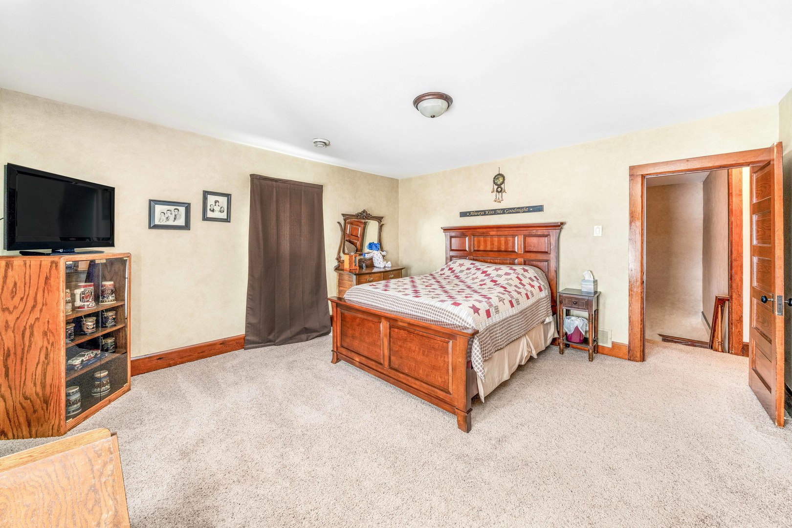 3478 Chicago Road Paw Paw, IL 61353 - Photo 20 of 49 a bedroom with a bed and a flat screen tv