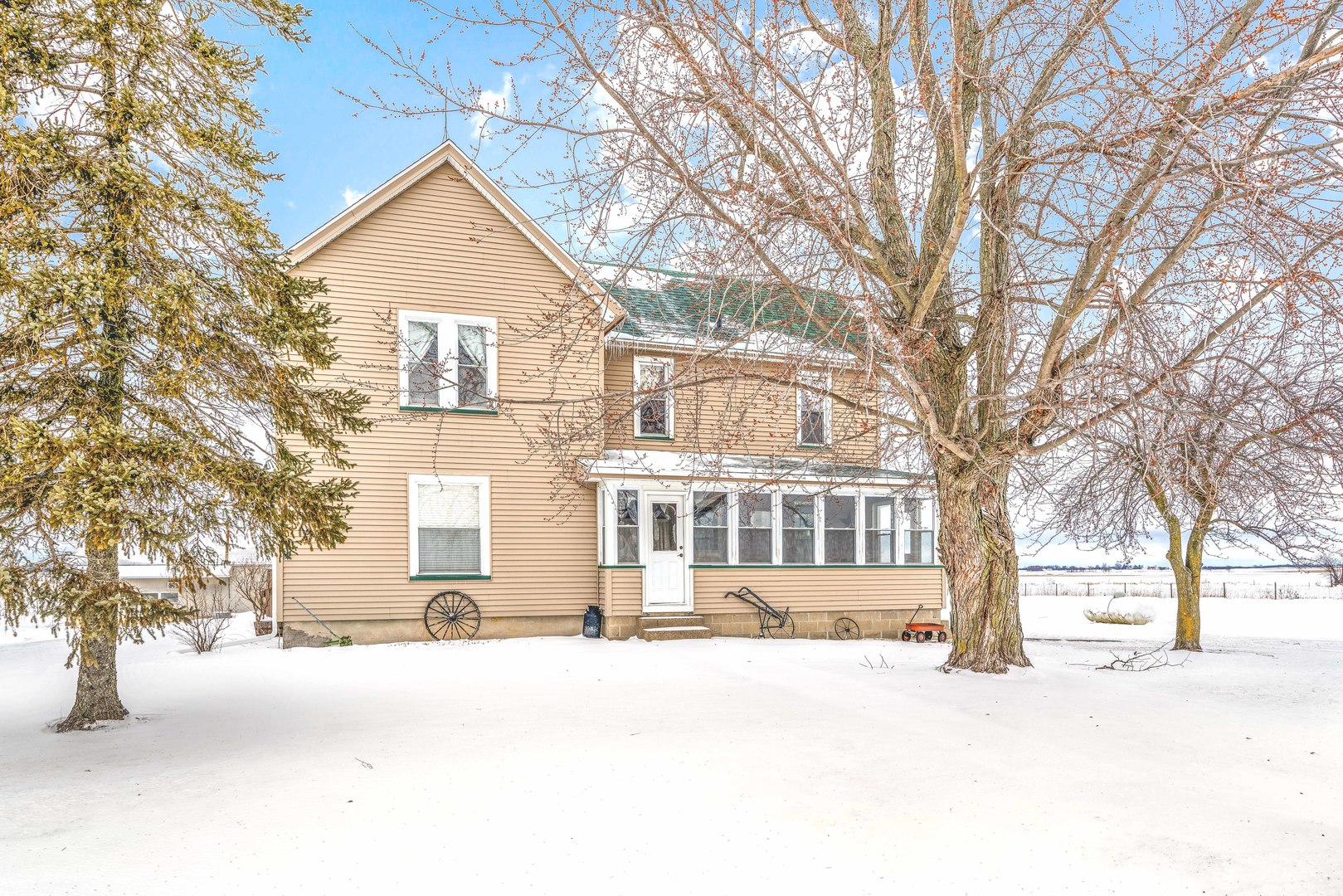 3478 Chicago Road Paw Paw, IL 61353 - Photo 2 of 49 a front view of a building with a yard