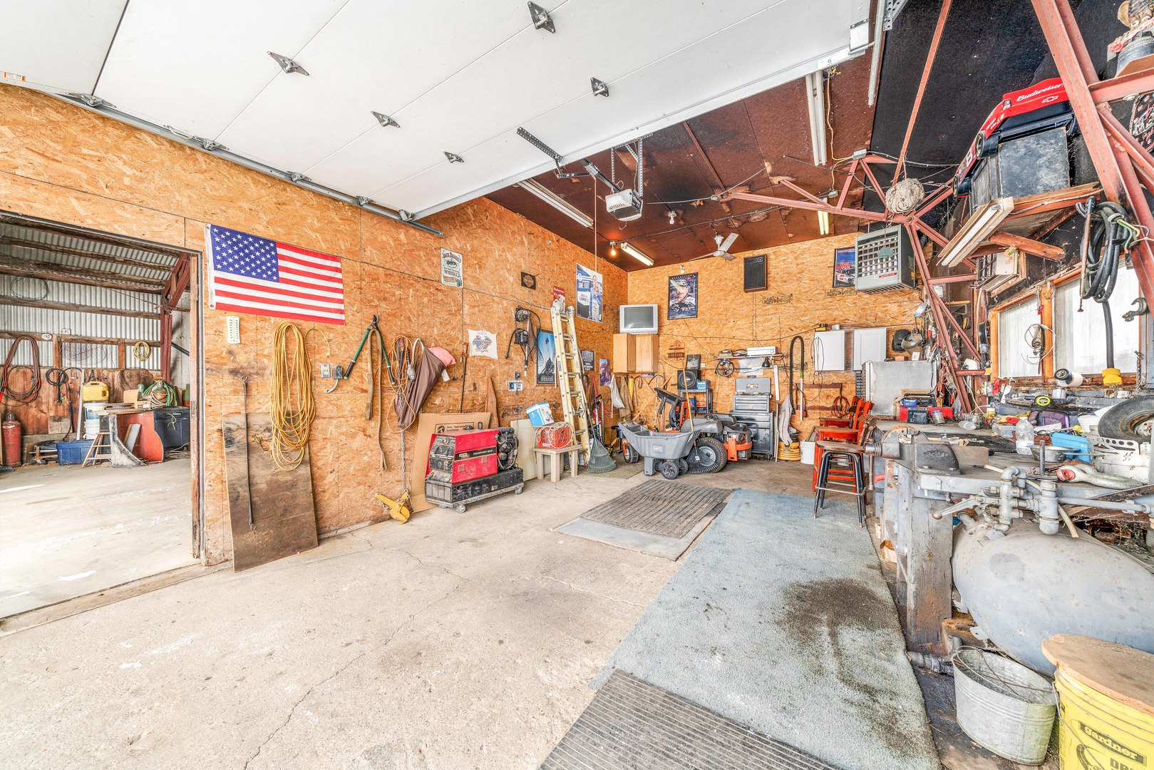 3478 Chicago Road Paw Paw, IL 61353 - Photo 30 of 49 a view of a garage with parked cars