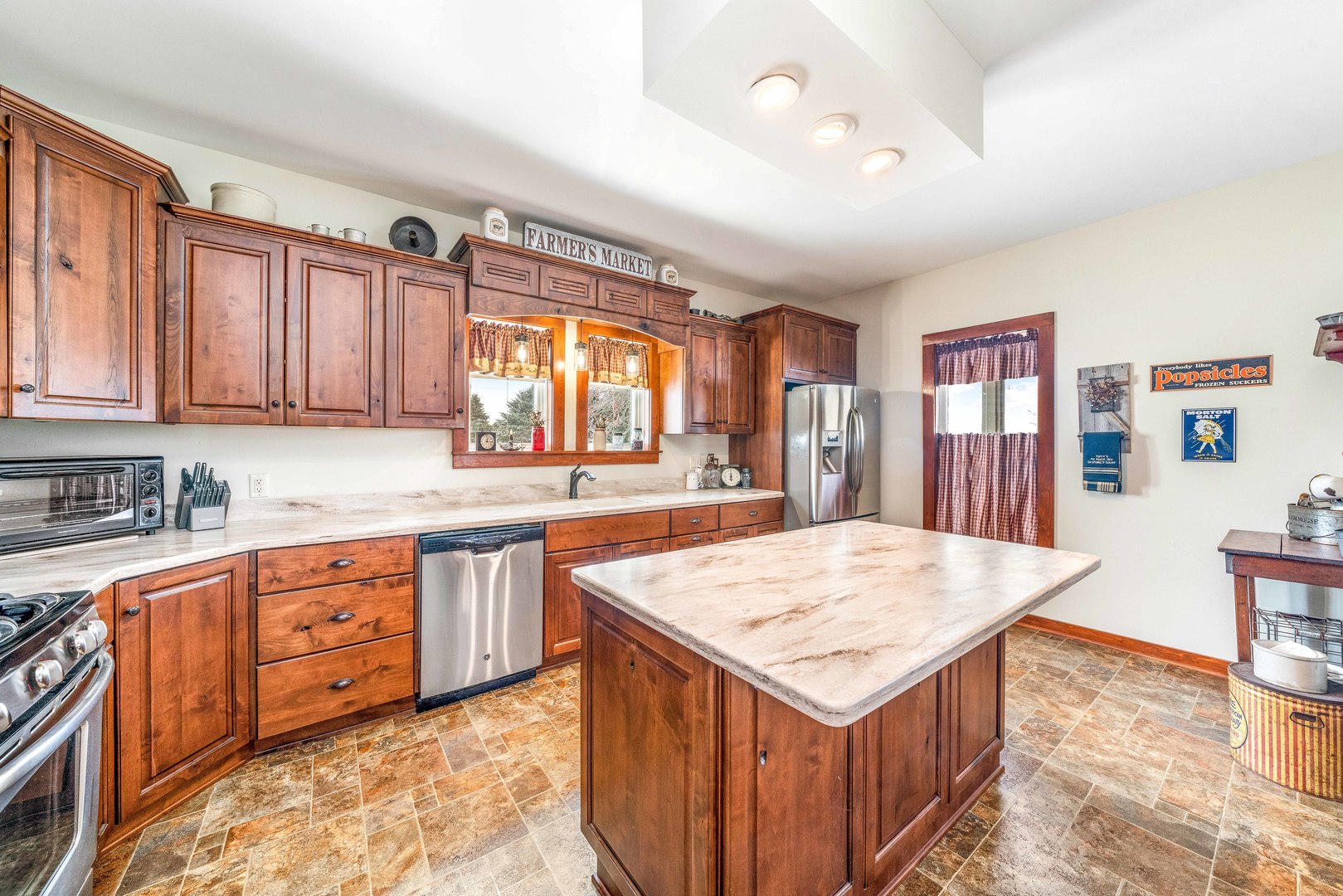 3478 Chicago Road Paw Paw, IL 61353 - Photo 8 of 49 a kitchen with stainless steel appliances granite countertop a table chairs sink and cabinets