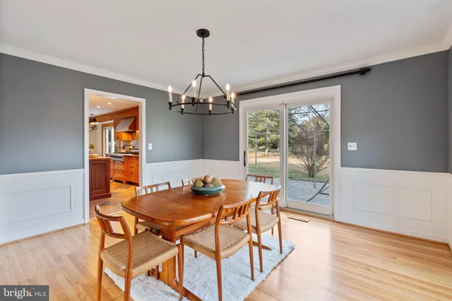 a kitchen with kitchen island granite countertop a sink cabinets and stainless steel appliances