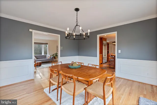 a kitchen with kitchen island granite countertop a refrigerator and a sink