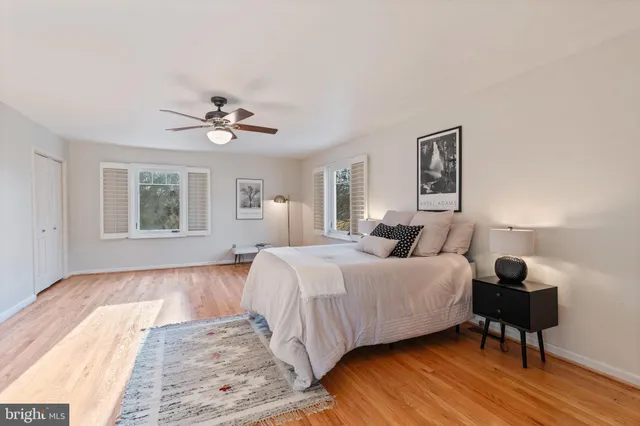a living room with furniture a fireplace and a table