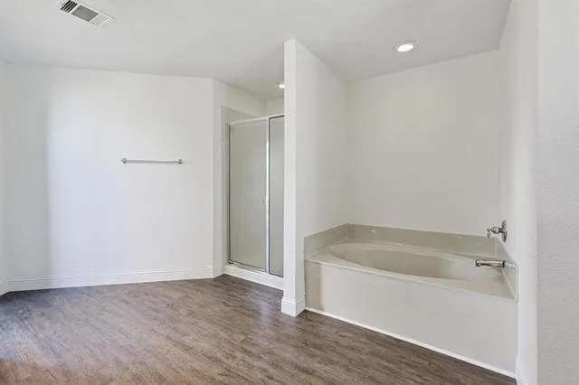 a white bath tub sitting in a bathroom