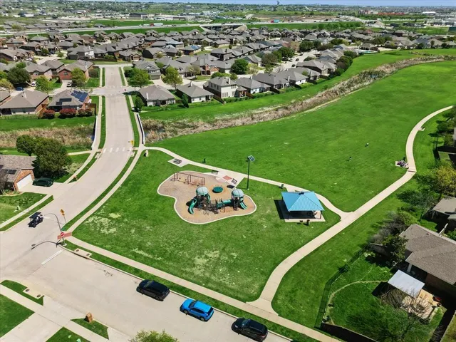 an aerial view of a golf course with parking space
