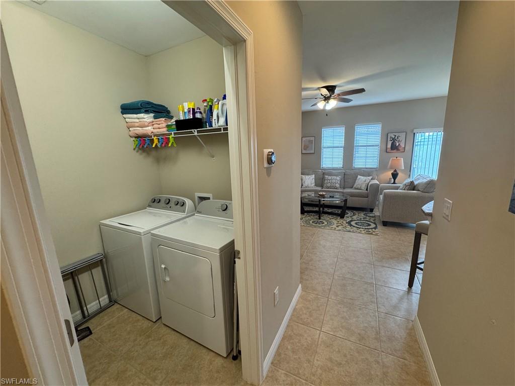 1431 Santiago Circle, Unit 1901 Naples, FL 34113 - Photo 21 of 29 a view of storage and utility room with a washer and dryer