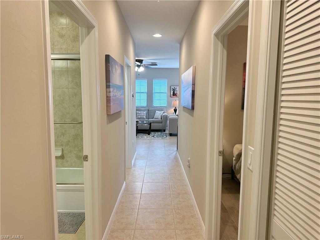 1431 Santiago Circle, Unit 1901 Naples, FL 34113 - Photo 22 of 29 a view of a bathroom from the hallway