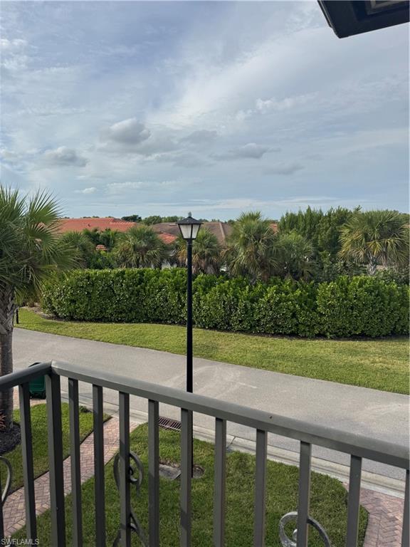 1431 Santiago Circle, Unit 1901 Naples, FL 34113 - Photo 28 of 29 a view of a yard with a fence