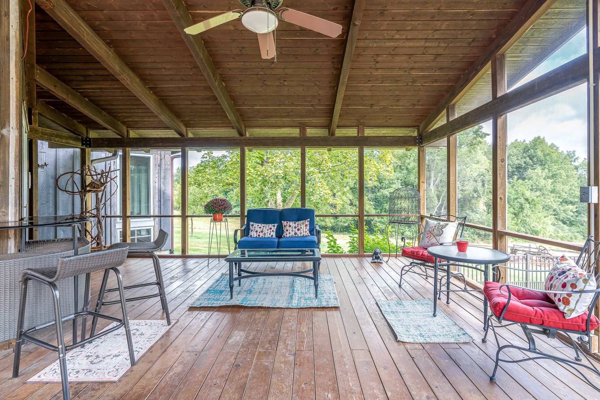 6775 West Blackjack Road Hanover, IL 61041 - Photo 4 of 33 a view of a patio with wooden floor and outdoor seating