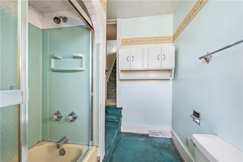 620 Virginia Avenue Rochester, PA 15074 - Photo 17 of 36 a bathroom with a tub and a shower