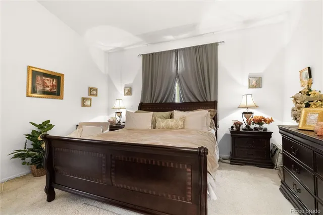 a bedroom with a bed and a furniture