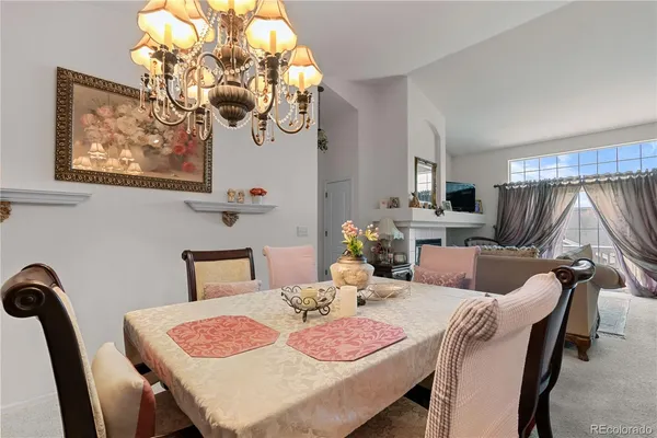 a dining room with furniture and window
