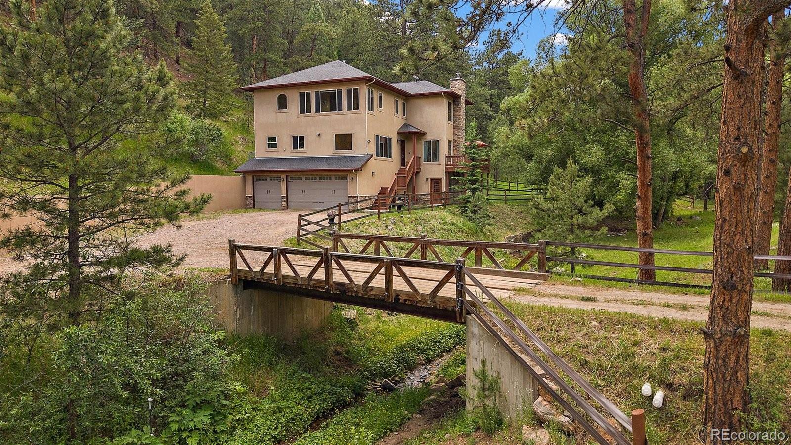 a view of house with outdoor space and sitting area