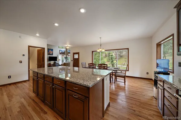 a kitchen with stainless steel appliances granite countertop lots of counter top space