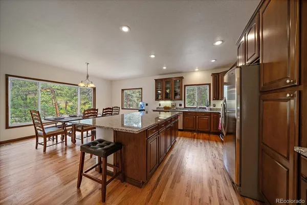 a view of a room with wooden floor and windows