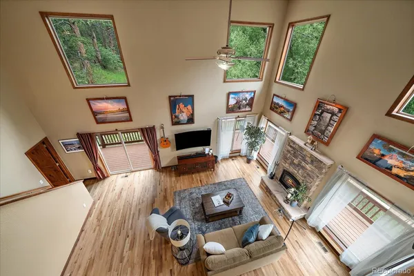 a spacious bedroom with a bed and a flat screen tv