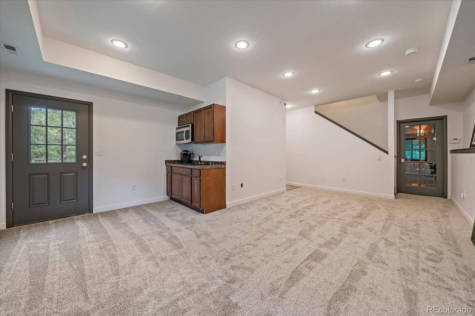 27756 Troublesome Gulch Road Evergreen, CO 80439 - Photo 33 of 47 a view of an empty room with a window