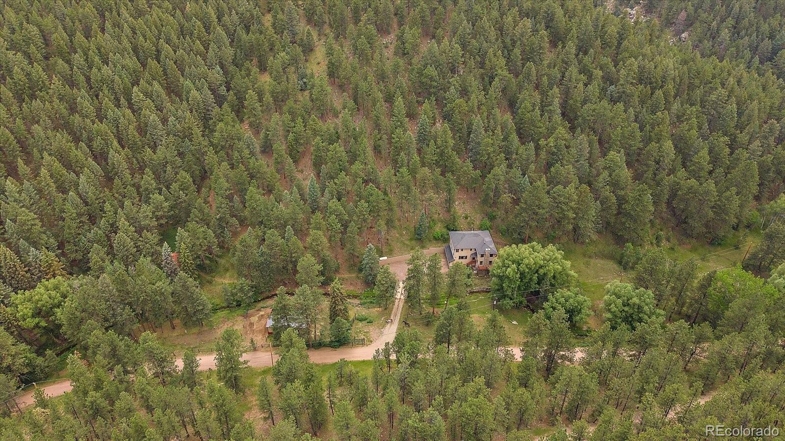 27756 Troublesome Gulch Road Evergreen, CO 80439 - Photo 45 of 47 a view of a yard