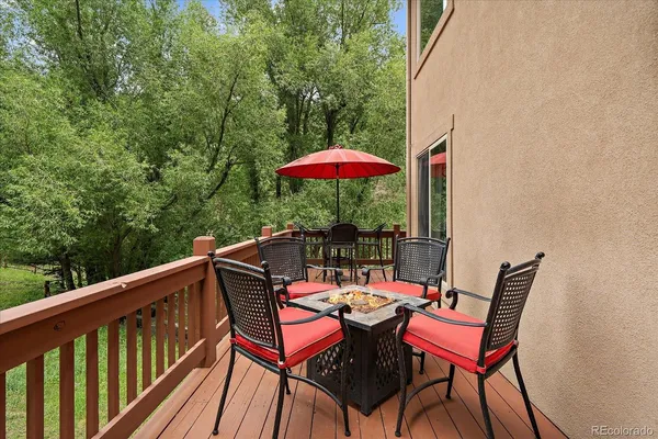 a view of a balcony with furniture