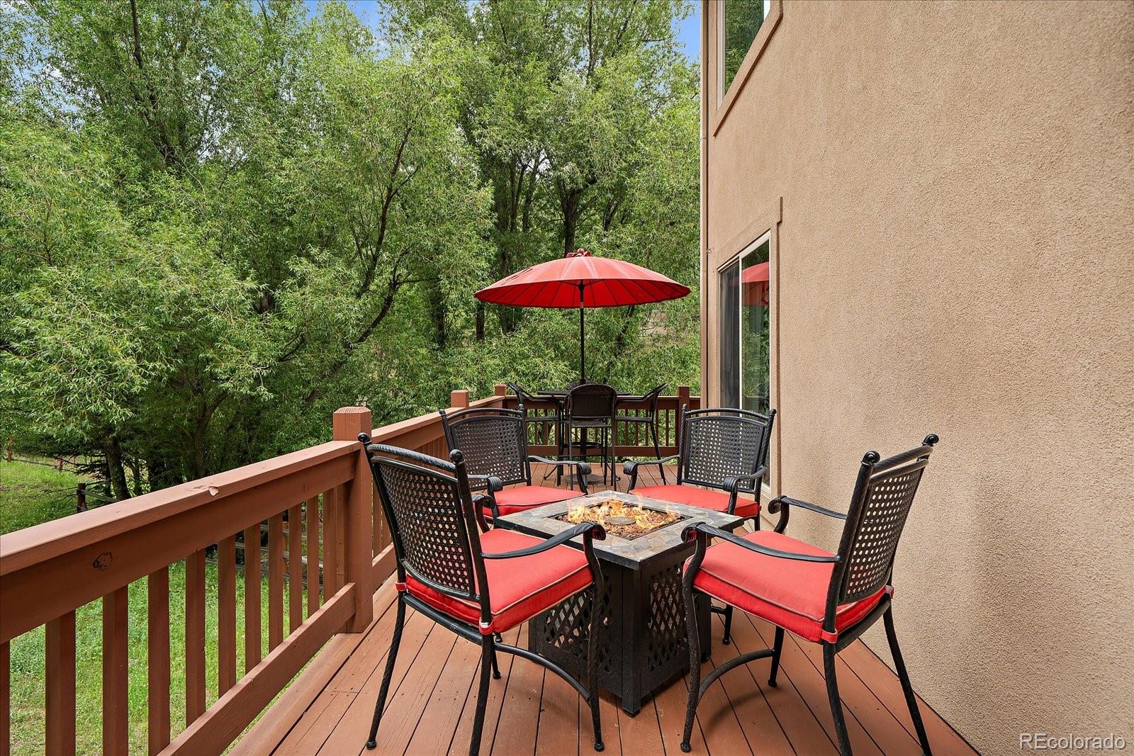 27756 Troublesome Gulch Road Evergreen, CO 80439 - Photo 8 of 47 a view of a balcony with furniture