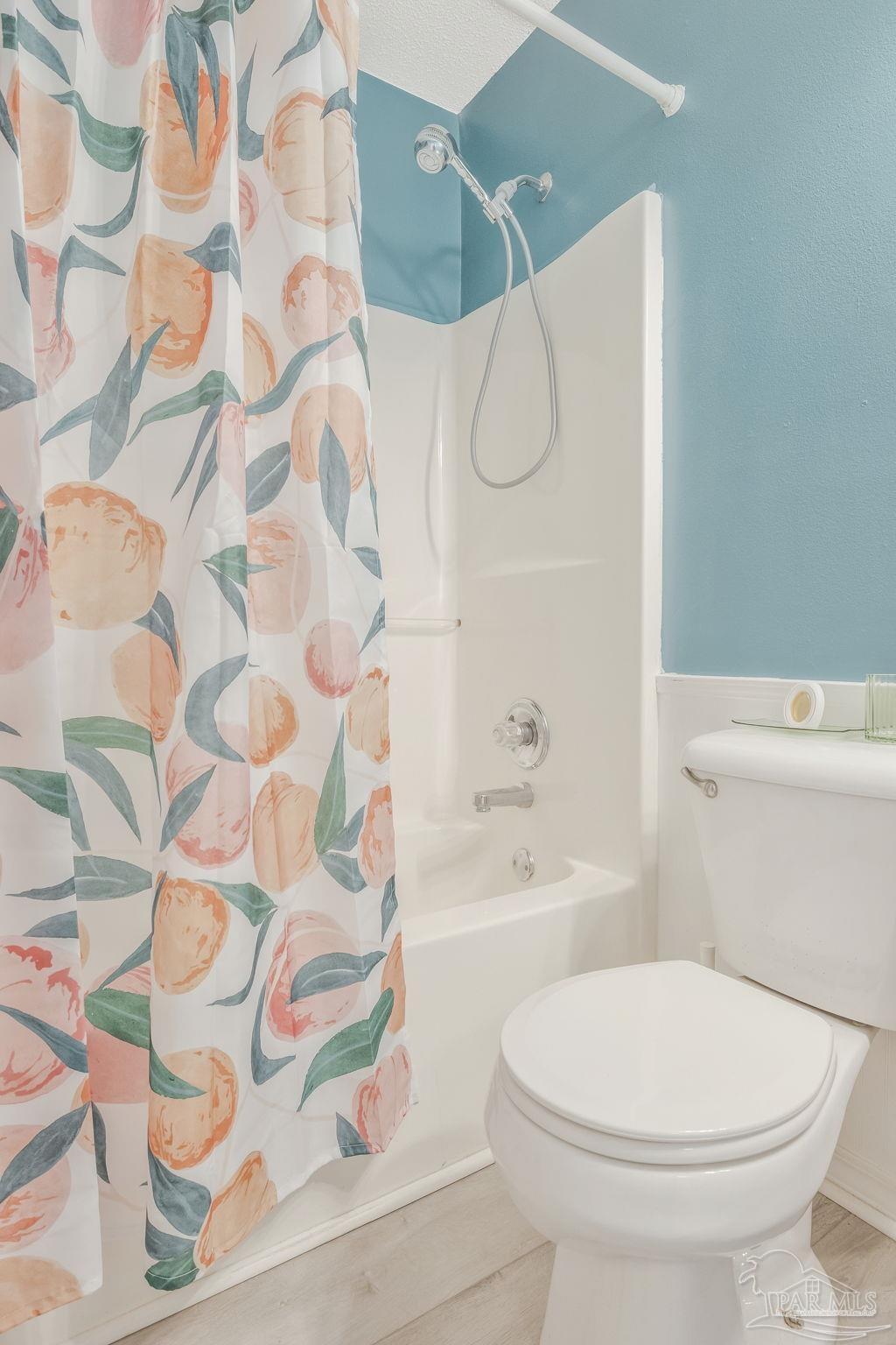 5539 Windrun Place Pace, FL 32571 - Photo 21 of 62 a white toilet sitting next to a bathroom sink