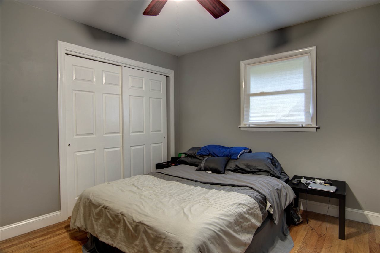 5981 Whitecliff Road Rockford, IL 61109 - Photo 11 of 25 a bedroom with a bed and a window