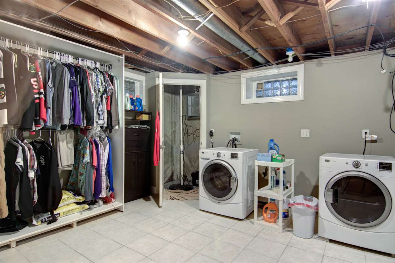 5981 Whitecliff Road Rockford, IL 61109 - Photo 18 of 25 a view of walk in closet with clothes shoes and a washer