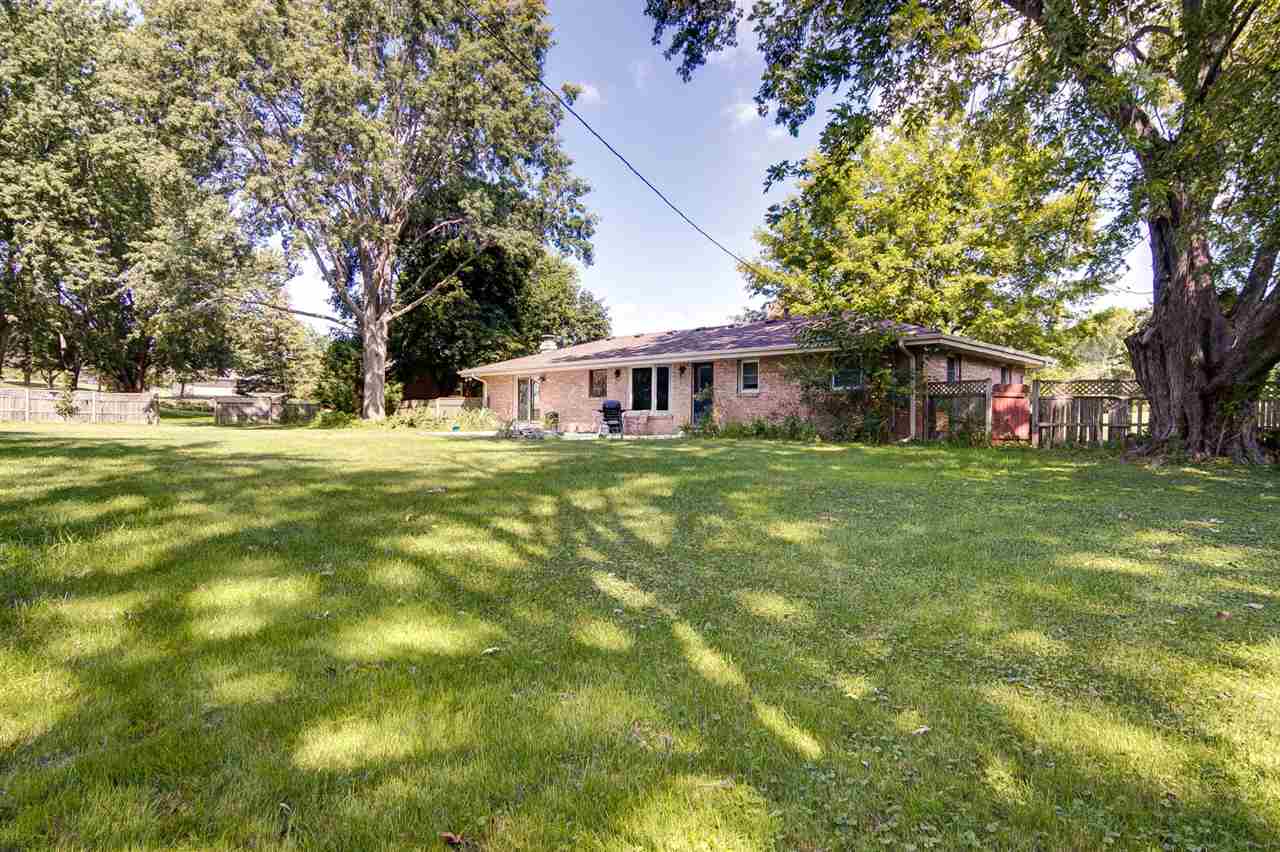 5981 Whitecliff Road Rockford, IL 61109 - Photo 24 of 25 a view of a house with a big yard