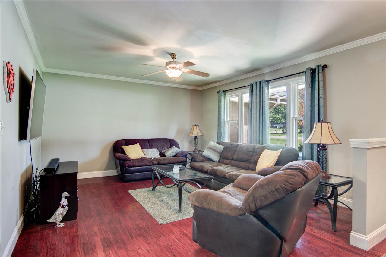5981 Whitecliff Road Rockford, IL 61109 - Photo 3 of 25 a living room with furniture and a wooden floor