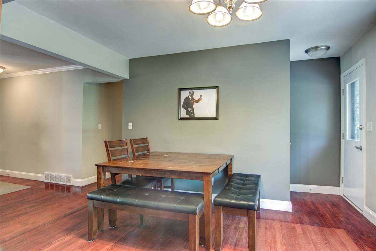 5981 Whitecliff Road Rockford, IL 61109 - Photo 6 of 25 a view of a workspace with furniture and wooden floor