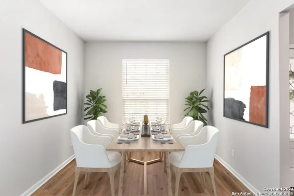 a dining room with furniture and window